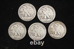 Lot of 5 Walking Liberty Half Dollars. 90 Silver All Coins have readable Dates